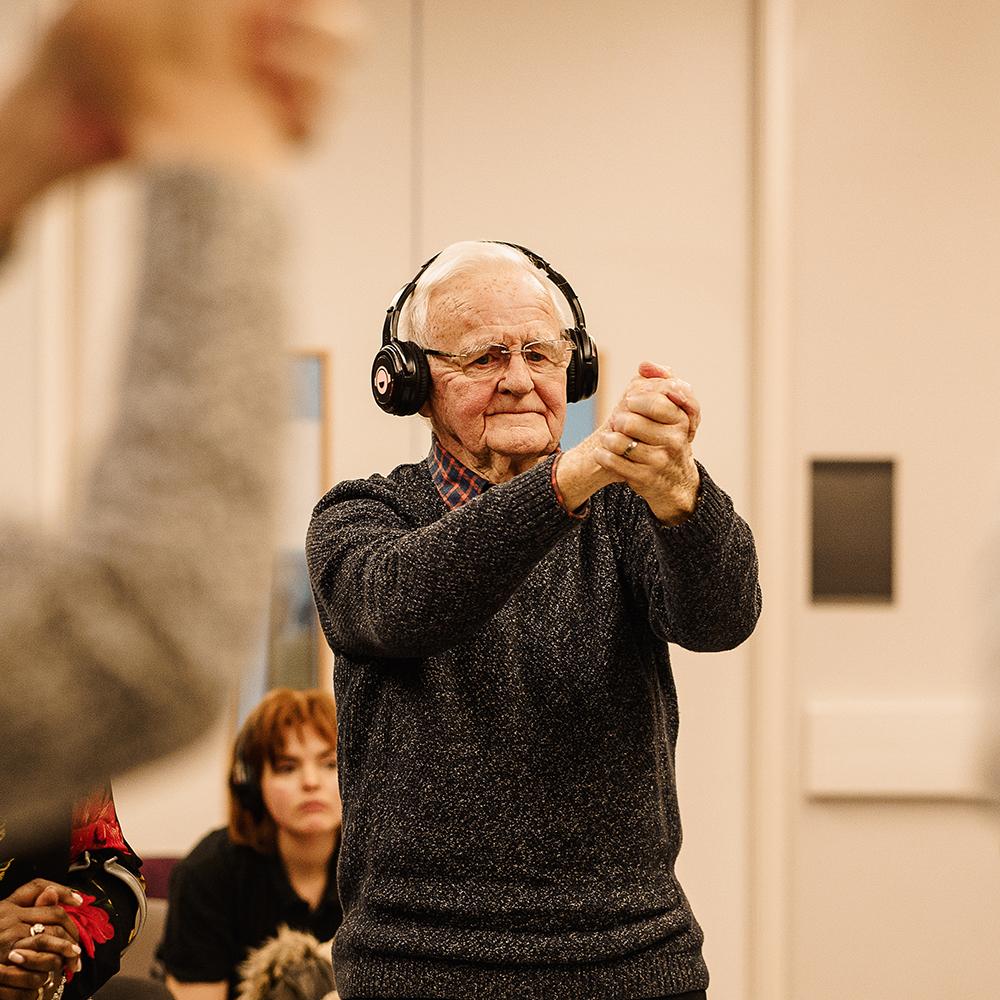 man performing wearing headphones