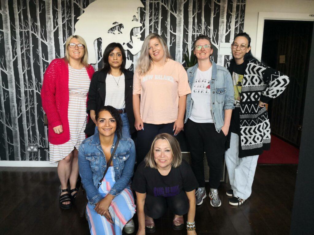 The group of women who helped make the audio story from Early Break stand together for a group photo at Blueprint recording studio in Salford in Greater Manchester.